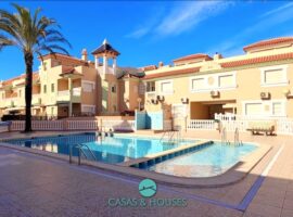 Spectacular corner townhouse with a private solarium and an impressive garage.